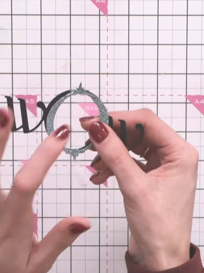 Step 3: Position the layered oval die-cut frames on your card base, offsetting them slightly to one side for visual in