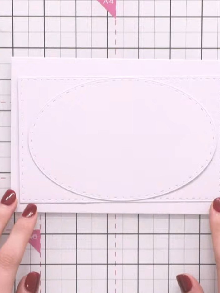 Step 5: Add embellishments such as flowers or stamps around the curved edges of the ovals if desired. Position decorat