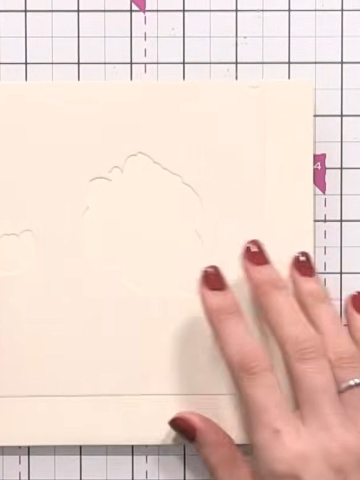 Step 2: Line up the stencil with the edge of your card, using the heart registration marks in the corner as guides to 