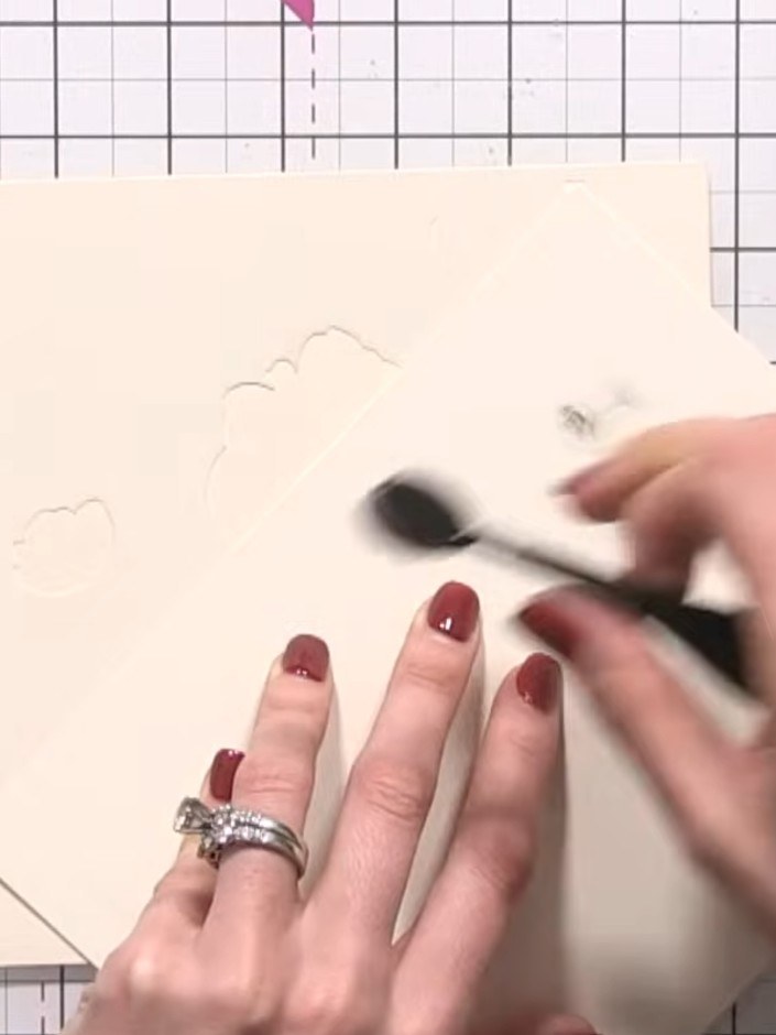 Step 8: Position the second layer stencil over the right side of the card. Apply the same coloured ink or a darker sha