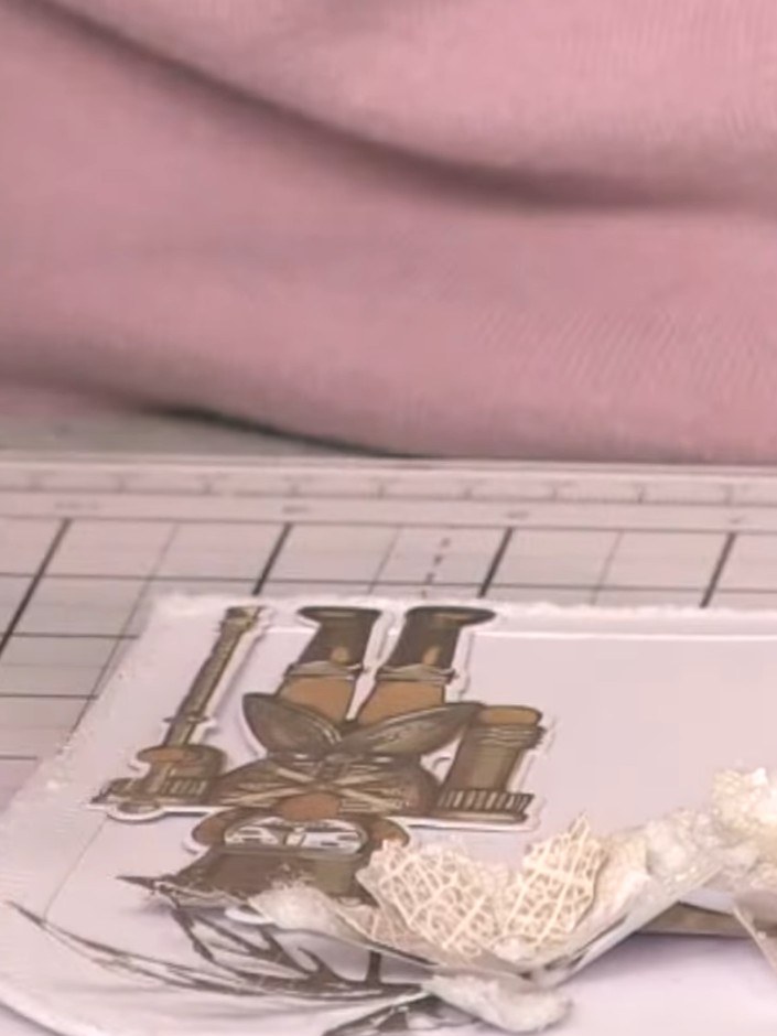Step 8: Adhere all the floral elements to the card using adhesive pads to create dimension. Position the nutcracker im