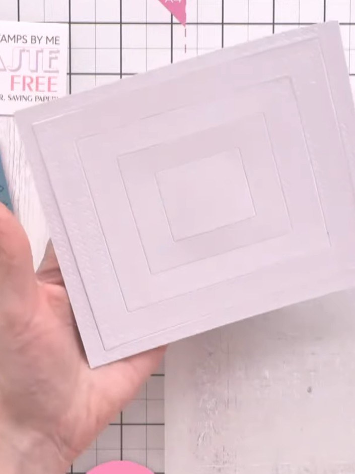 Step 5: Observe how the ink settles into the embossed lines on the card, making the detail more visible. The embossed 