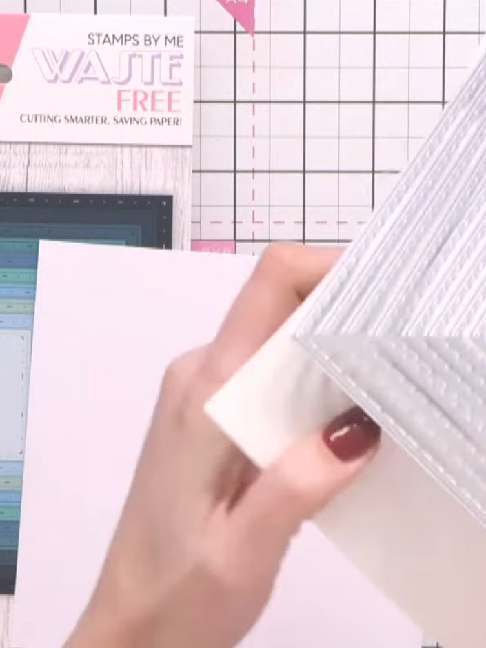 Step 2: Secure the nesting dies to your white card using tape to keep them connected in position whilst you run them t