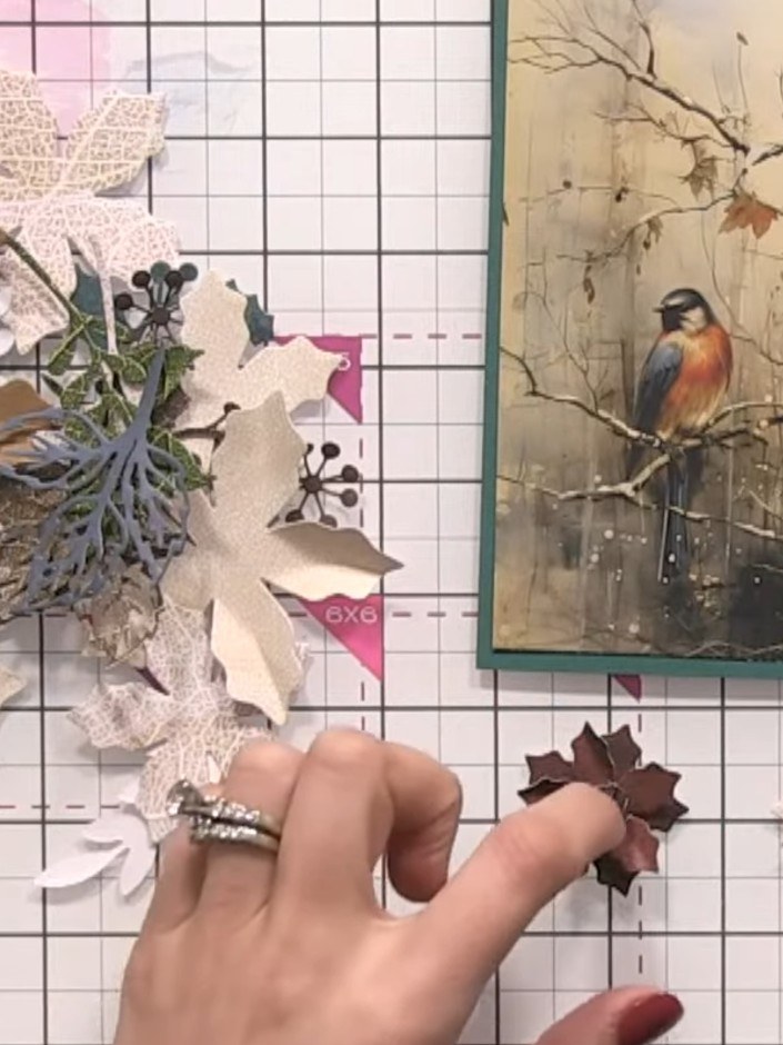 Step 6: Die-cut foliage pieces from the skeleton leaf paper using the Holly & Berry dies to create greenery elements f