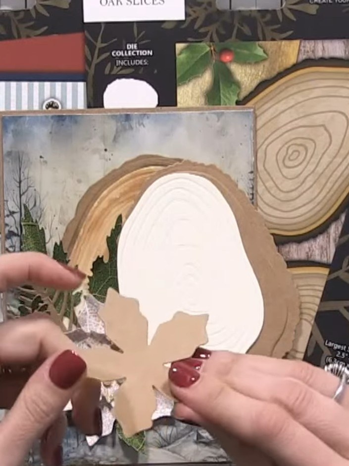 Step 6: Glue the poinsettia flower next to or overlapping the oak slice on your card front. Position it so the flower 