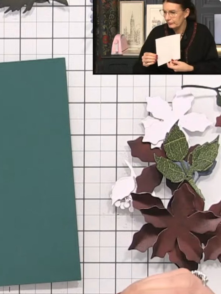 Step 3: Layer the poinsettia petals by pinching the edges and nesting smaller petals inside larger ones to create dime