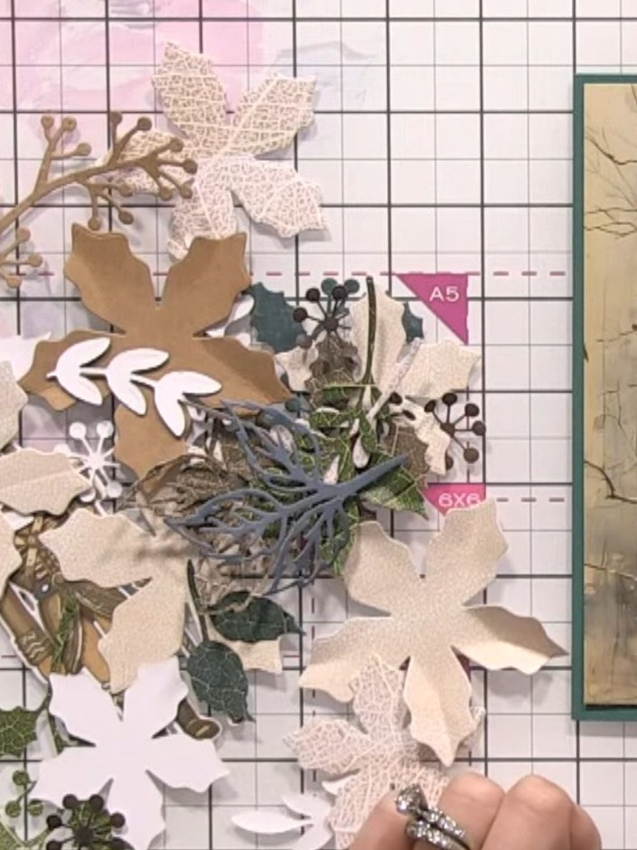 Step 4: Create smaller poinsettia flowers using the red and lighter coloured papers from the Holly & Berry collection.