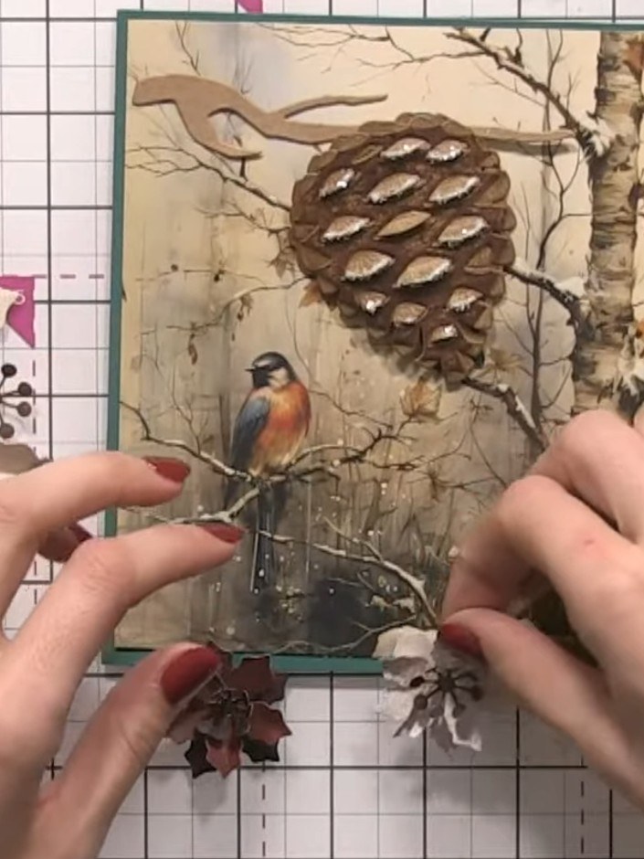 Step 6: Apply glue to the tips of the large pine cone. Dust the glued areas with crystal clear colourless mixed media 