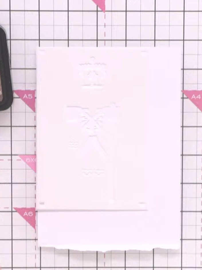 Step 2: Position the stencil over your white card base. Apply Distress Ink through the stencil using a sponge dauber, 