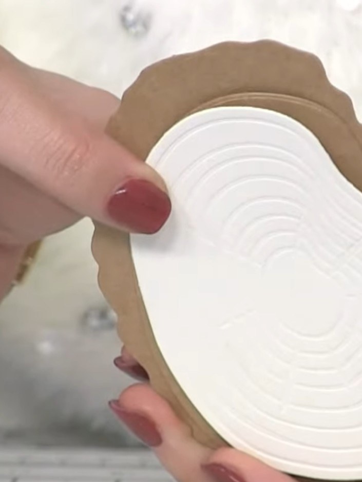 Step 2: Run the inked die through your die-cutting machine to cut and emboss the oak slice shape from craft-coloured c