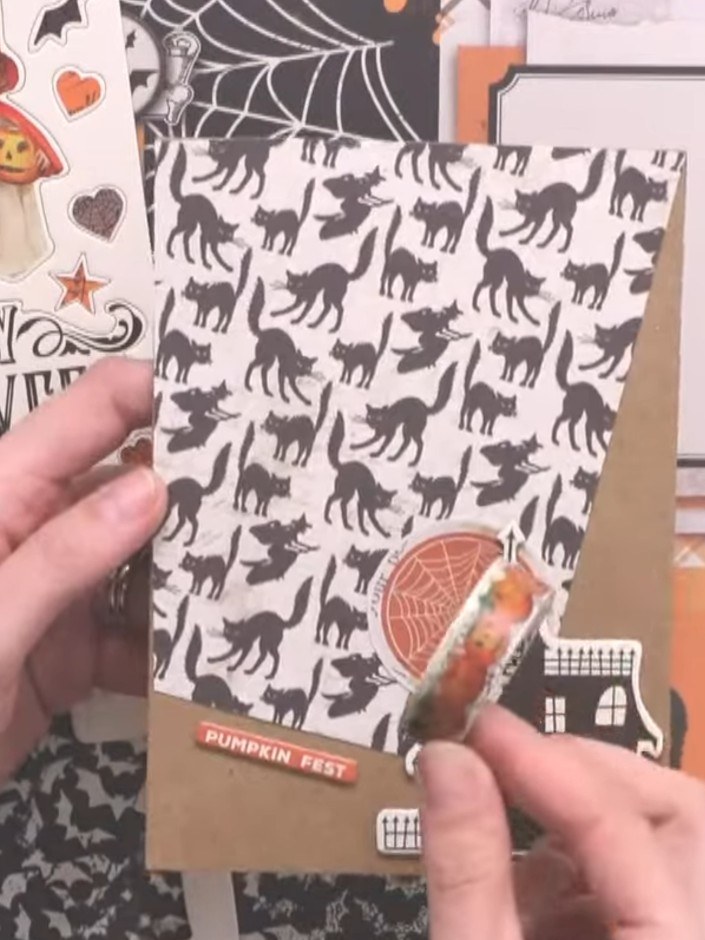 Step 5: Add a spiderweb element to the opposite corner of the card to balance the design. Position the web motif in th