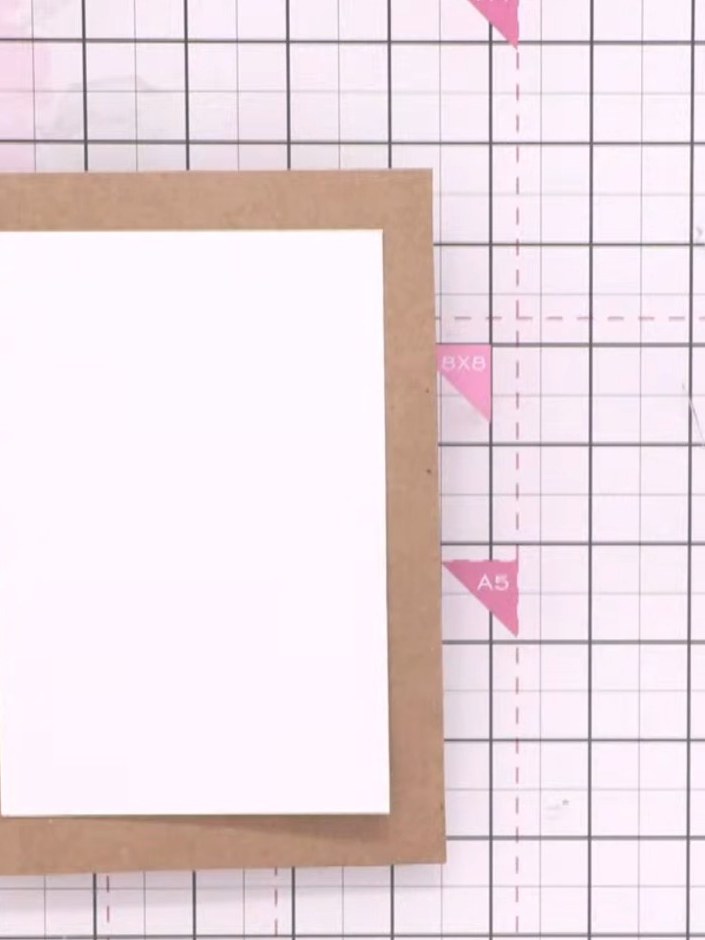 Step 1: Trim your white watercolour card to a smaller size to create a mini card format. Place the trimmed white card 