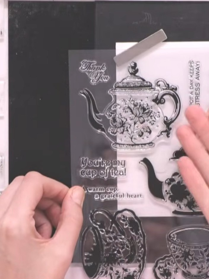 Step 2: Ink the solid teapot stamp with teal ink, tapping gently to ensure even coverage across the stamp surface.