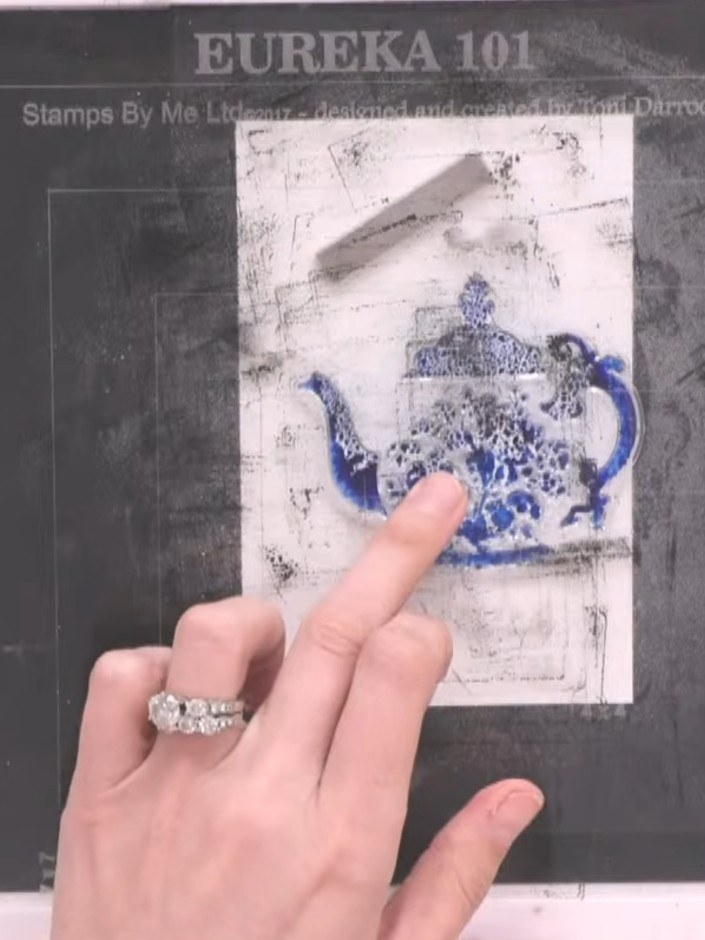 Step 3: Spray the inked stamp three times with water using a water spray bottle to create a wet, blendable surface on 