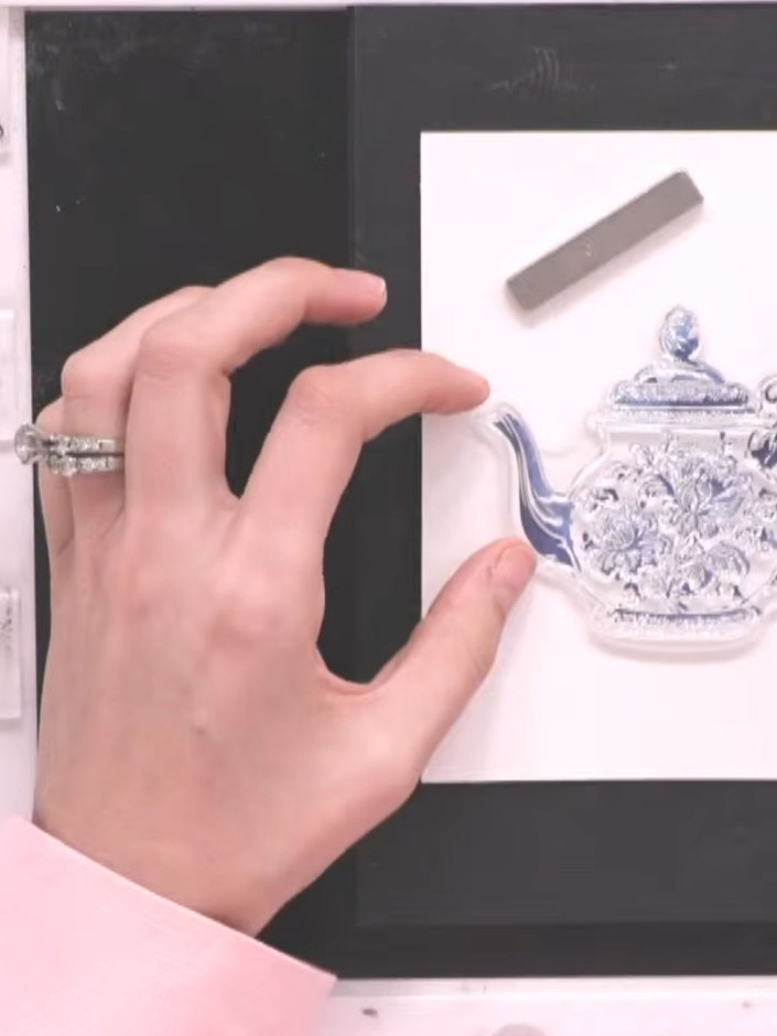 Step 7: Ink the detail stamp with the same teal colour. Stamp the image twice onto the teapot for better definition an
