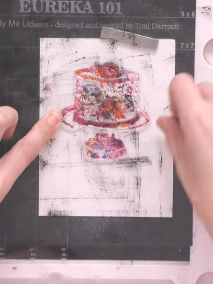 Step 2: Ink the solid cake stamp with multiple colours. Apply teal, pink, orange and purple ink across the entire stam