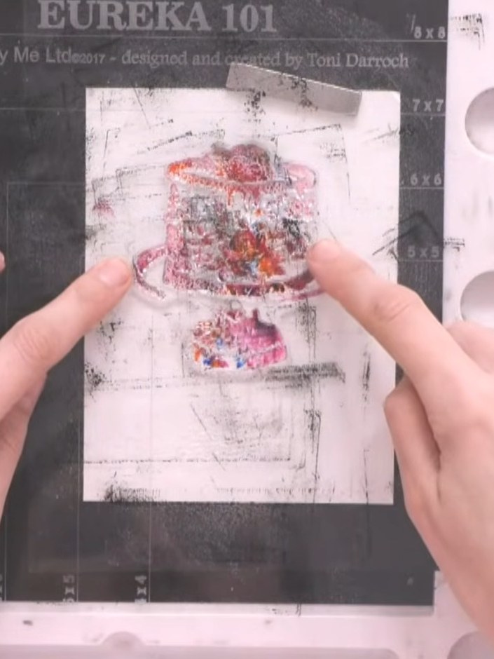 Step 3: Spray the inked stamp three times with water. Allow the water to activate the ink on the stamped image.