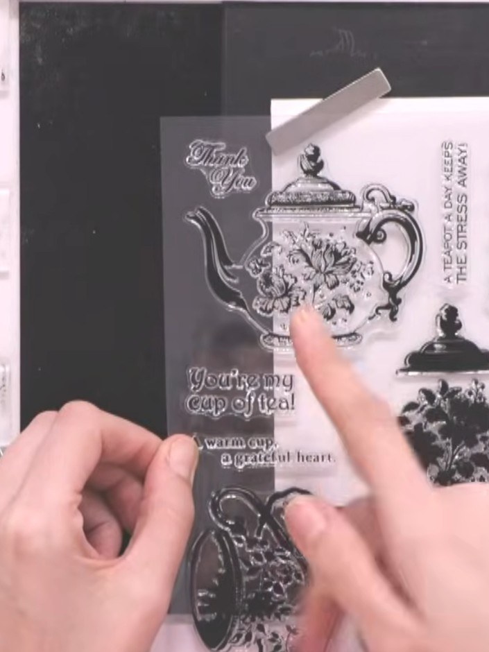 Step 2: Ink up the solid teapot stamp in teal ink, tapping gently to ensure even coverage across the stamp.