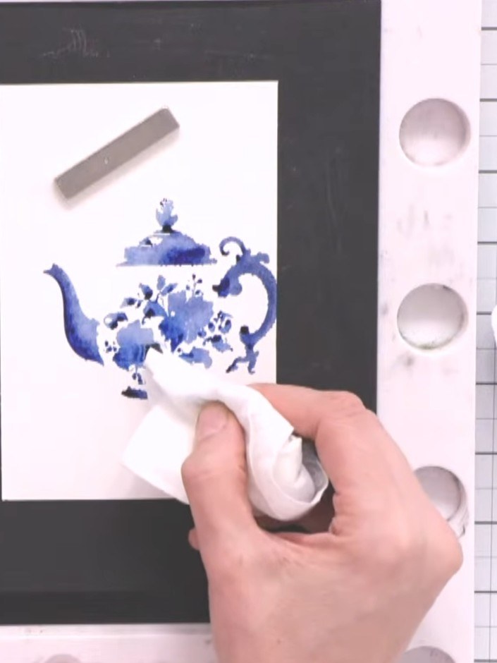 Step 6: Blot away any excess water puddles using a dry baby wipe, being careful not to disturb the stamped teapot imag