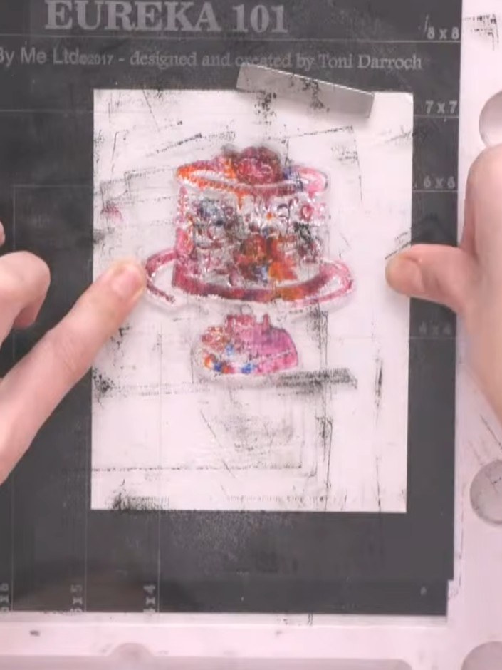 Step 2: Apply multiple ink colours directly to the solid cake stamp using the corner of the ink pads. Use teal, pink, 