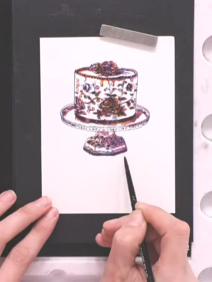 Step 9: Using a paintbrush, apply heather-coloured paint to create a shadow around the base of the cake stand. Extend 