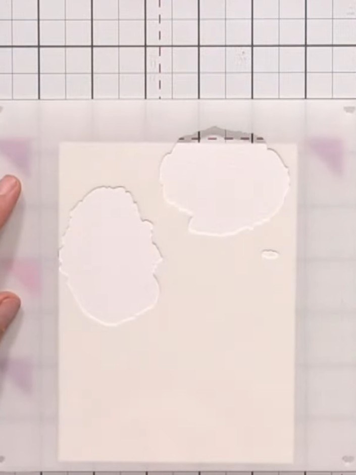 Step 2: Place your card stock on the craft mat. Position the first poppy stencil layer on top of the card stock, centr