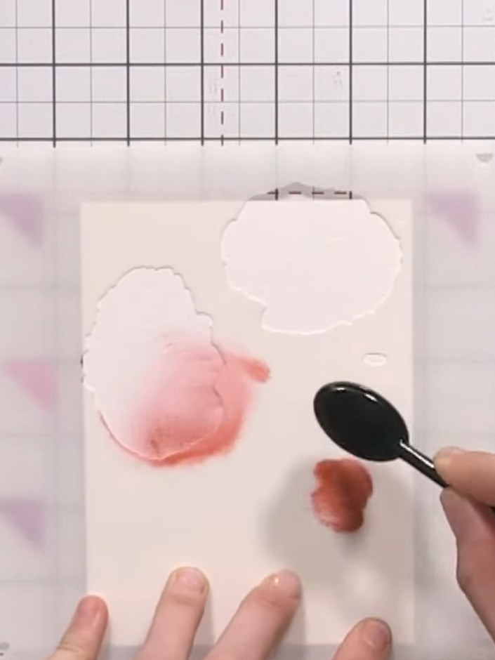 Step 4: Lightly spray the inked area with water using a spray bottle to create a blended watercolour effect on the sta