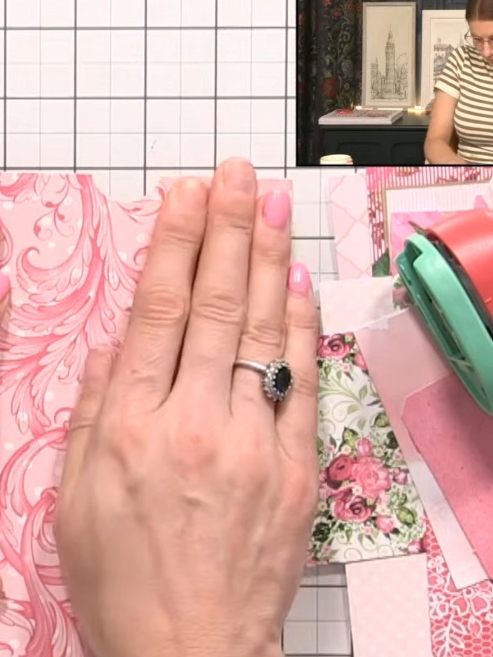 Step 3: Position a decorative paper panel with pink swirl and polka dot pattern on your album base. Use low-tack tape 