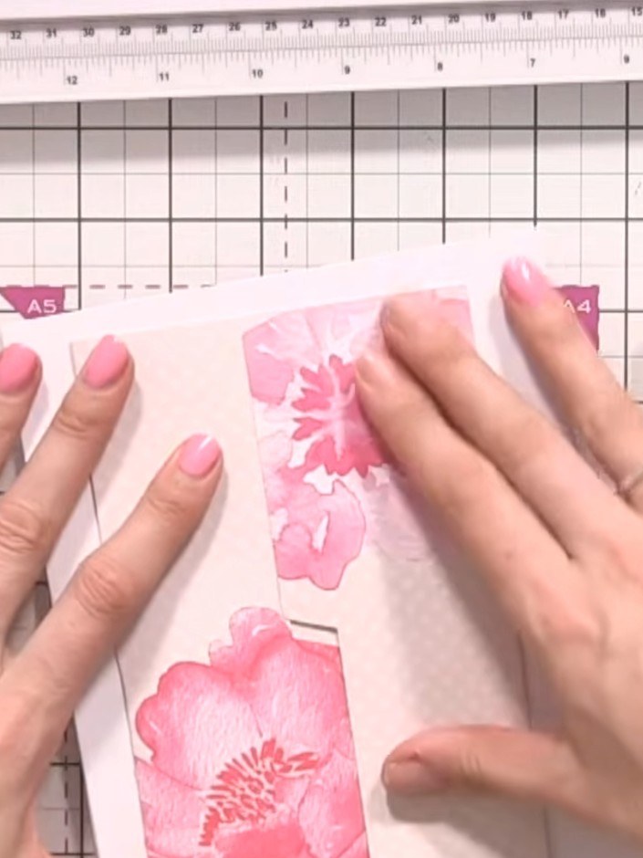 Step 5: Decorate the front of the card around the hinged door area. Add pink floral embellishments and sentiments to c