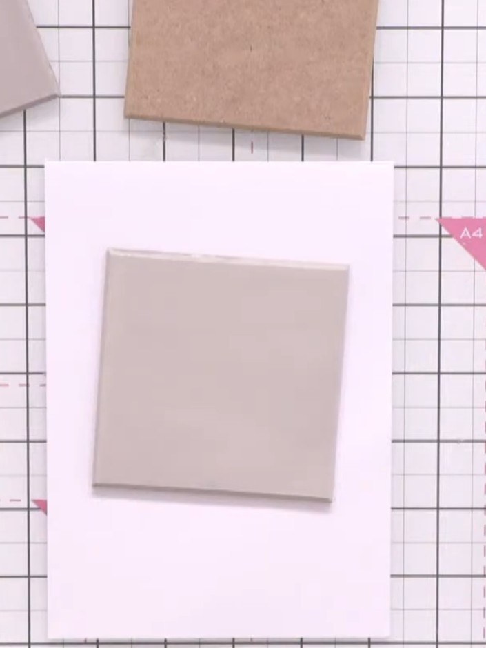 Step 2: Once the base coat is completely dry, position your classic rose layering stencil centrally on the MDF coaster