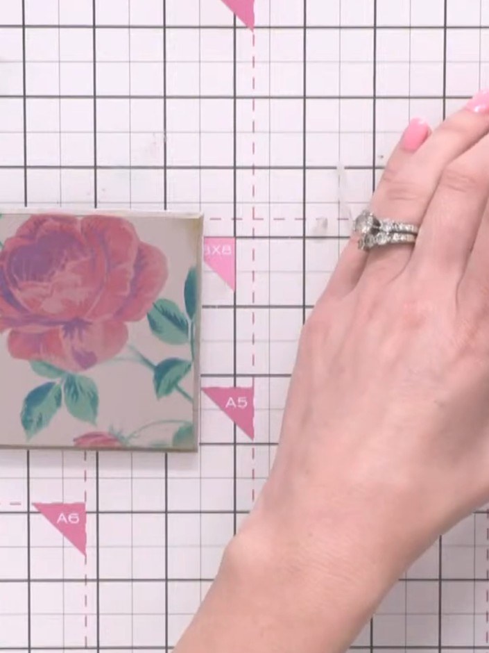 Step 12: Using a clean, dry brush, lightly dry brush white paint over the rose design to create a distressed, aged effe