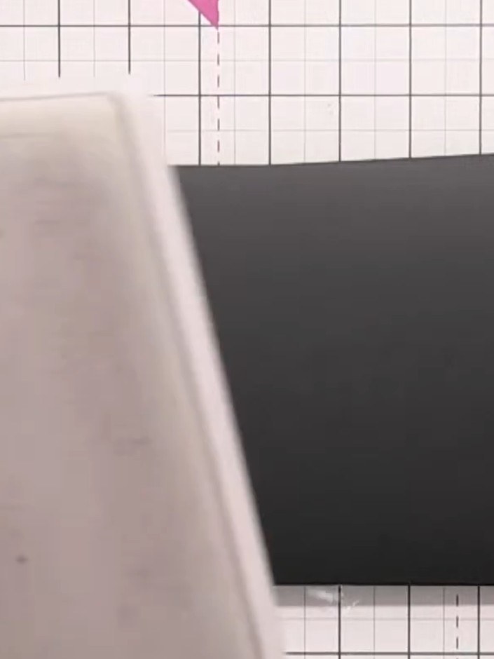 Step 1: Place your black card stock into the embossing folder with the rose design. Feed the folder through your embos