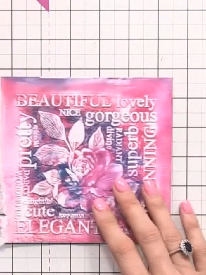 Step 7: Tap a black ink pad across the embossed card in a swiping motion to pick up all the raised details and create 
