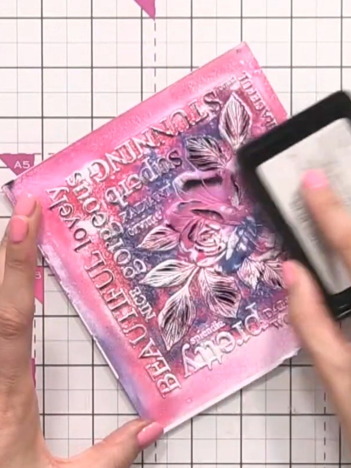 Step 8: Place your inked card into the embossing folder and run it through your die-cutting machine. This will set the