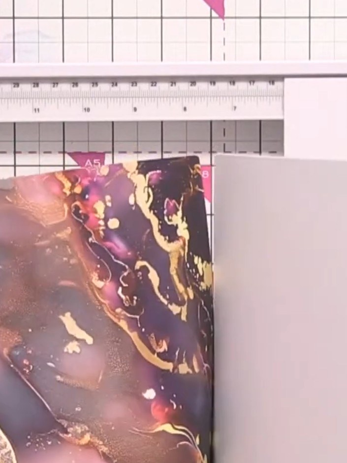 Step 1: Cut a piece of the golden frantage paper from the 8 x 8 paper pad to your desired card size. Position the deco