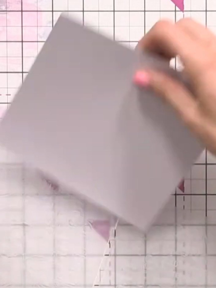 Step 3: Run the decorative paper through the embossing machine with the Elegant Rose stamp and embossing folder to emb