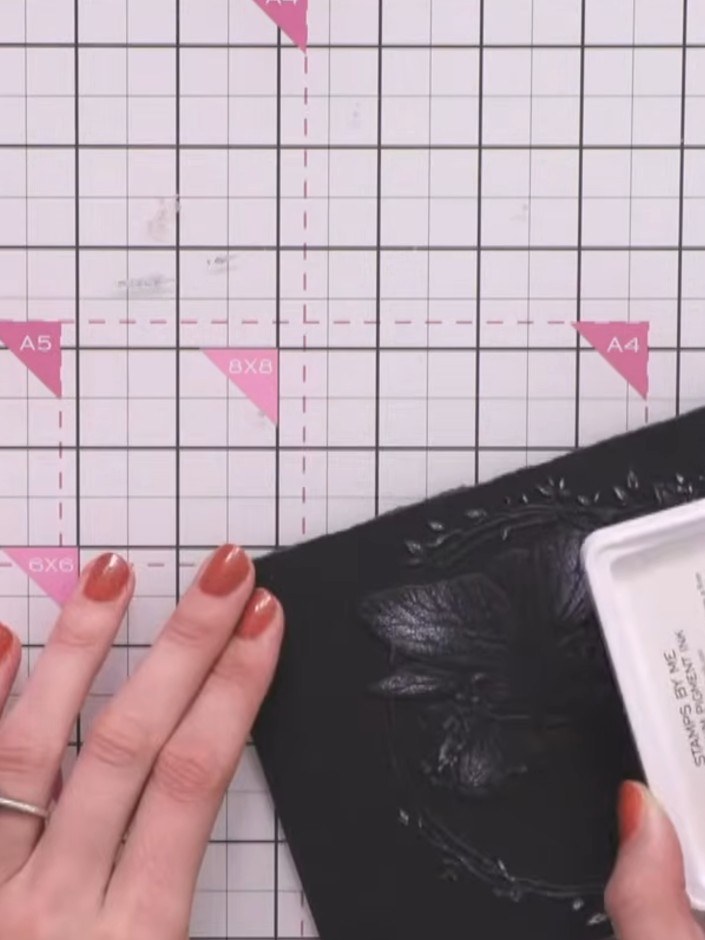 Step 6: If you get any harsh white lines from the embossing, blend them out by gently dabbing with the white ink pad t