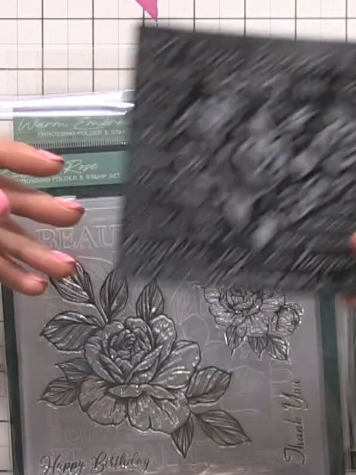 Step 2: Place the stamp and embossing folder with the inked card into your die-cutting machine and run it through to c