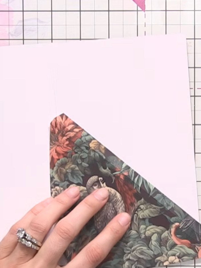 Step 6: Adhere the scored flap closure to the edge of your cover piece using the red liner tape provided, or alternati