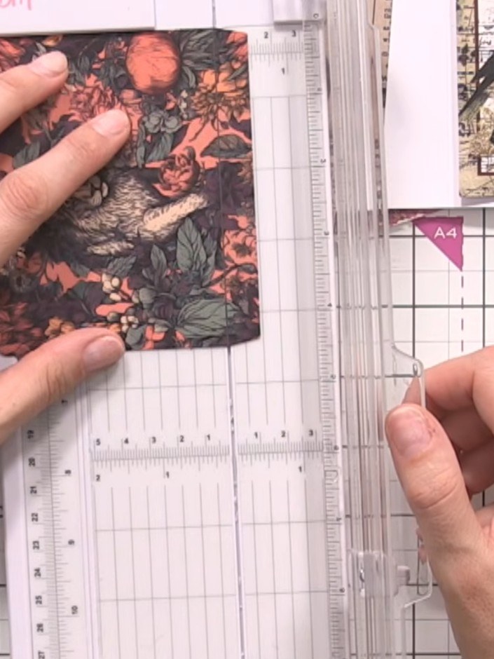 Step 7: Take one of the interactive page pieces that has score lines marked. Using your scoring tool and ruler, score 