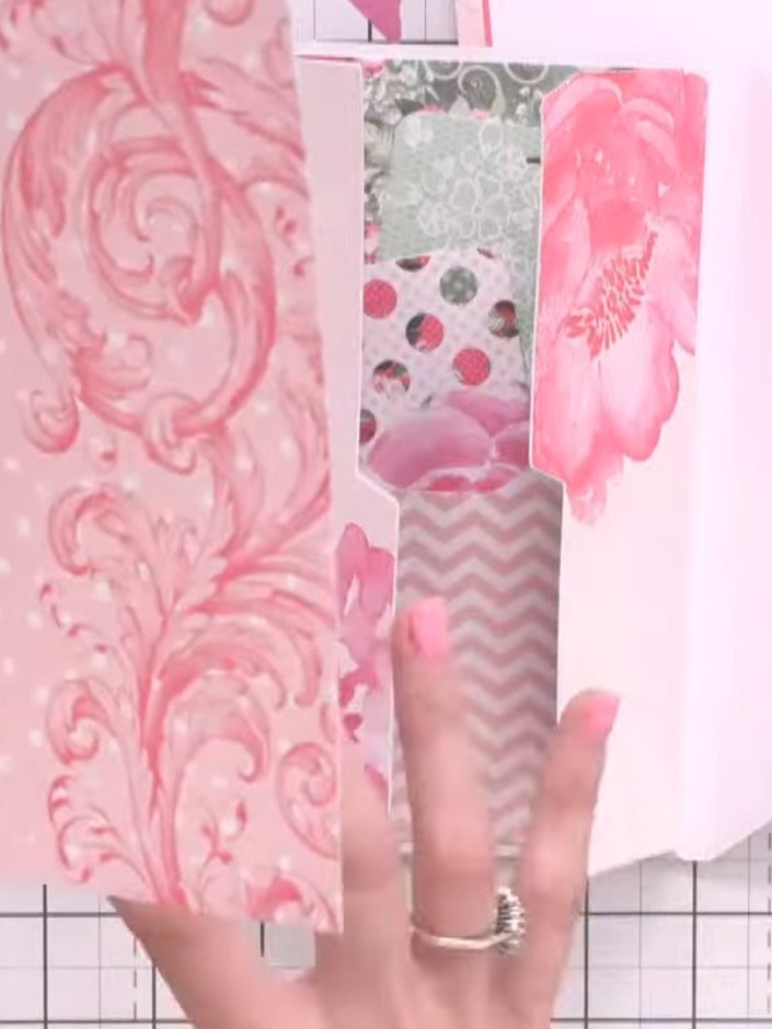 Step 9: Add decorative elements to the back cover of your album. You can attach a small pocket made from patterned pap