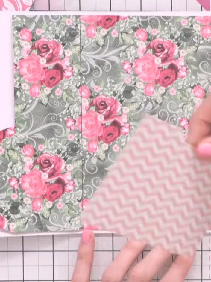 Step 4: Attach the third decorative pocket piece to the bottom of the page using glue, creating a cascading stacked ef