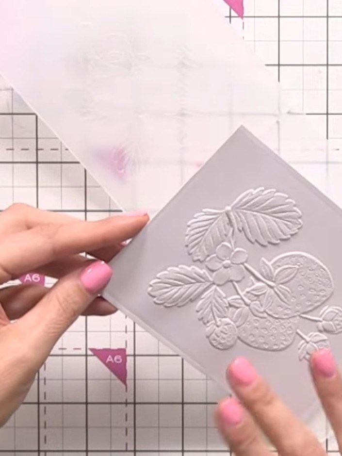 Step 2: Stamp the strawberry image onto the embossed pink card using hybrid ink. The hybrid ink won't bleed when you c