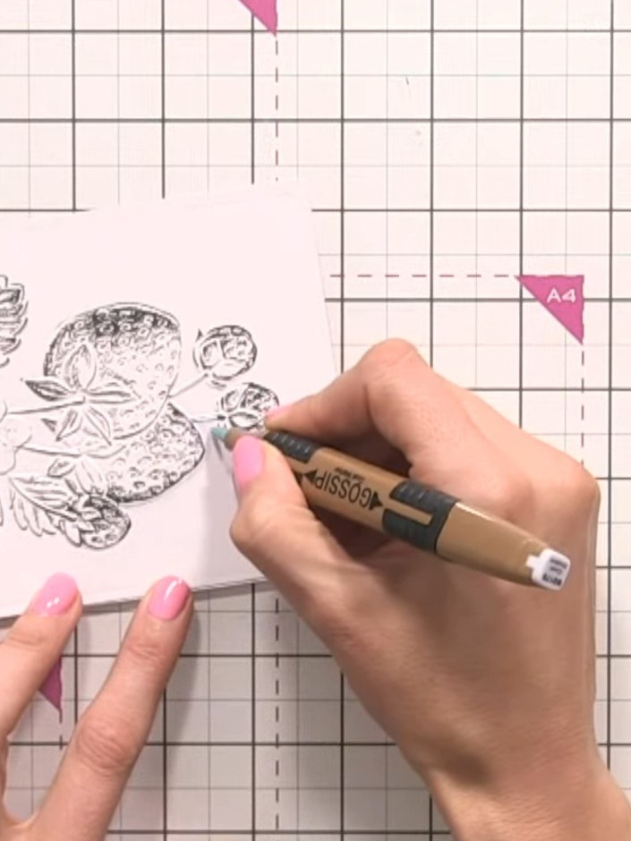 Step 4: Using a grey alcohol marker, outline the strawberries to add shadow and definition. Work carefully around the 