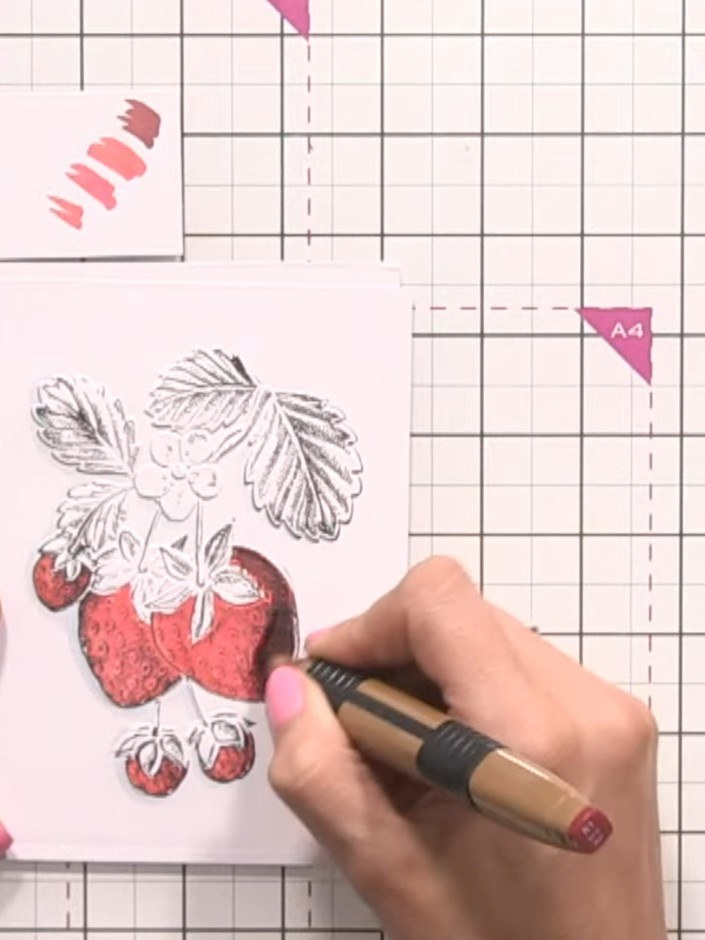 Step 7: Apply your darkest red shade to the shadowed areas of the strawberries. Blend back over with the lighter red c