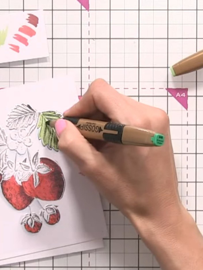 Step 8: Colour the strawberry leaves with light green marker. Add darker green to the shadowed areas and blend the col