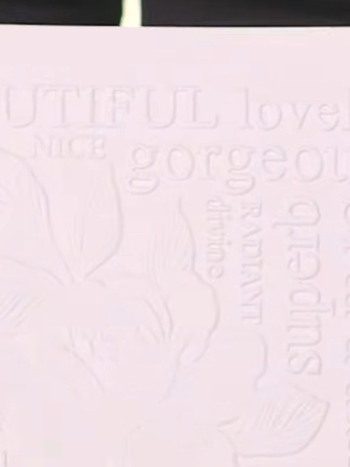 Step 2: Ink up the tree stamp with black pigment ink and stamp it firmly onto the embossed pink card, pressing down to