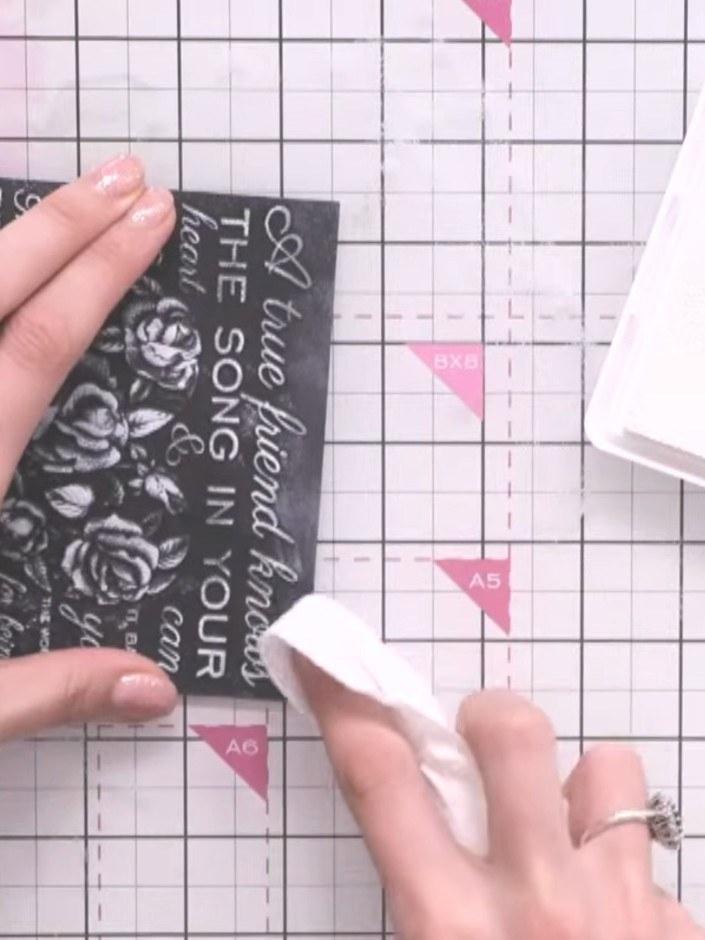 Step 5: Use your finger or a blending brush to gently soften any harsh lines where the white ink meets the black backg