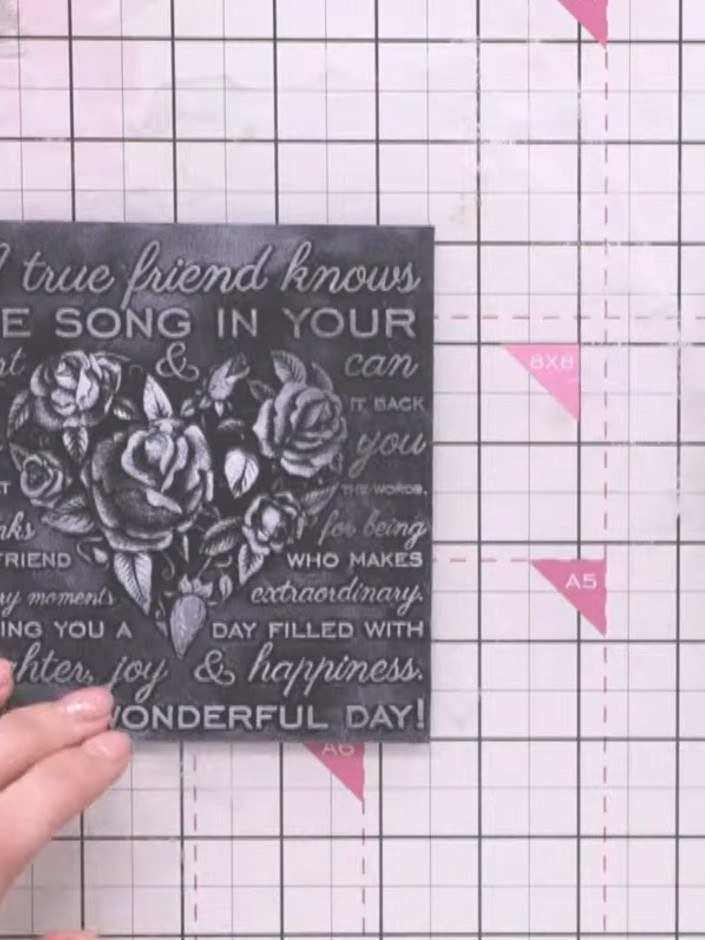 Step 6: Go back over the white areas with the Pure White pigment ink pad to reinforce the words and design details on 