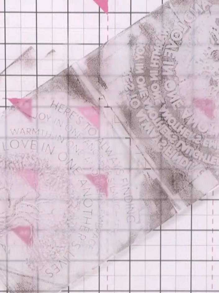 Step 3: Place your new piece of card stock onto the wet, inked embossing folder and run it through your embossing mach